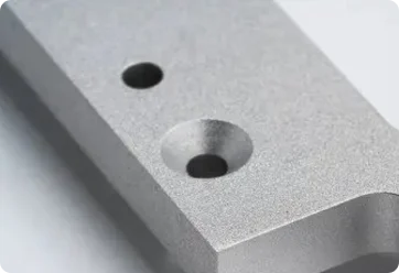Unionfab surface-finished metal 3D printed part with smooth edges and machined holes